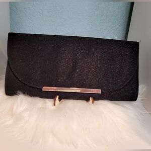 Call it Spring Black Clutch